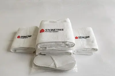 a group of white towels sitting on a table at Elegant 2BR Close to Park in Park Horizon in Dubai