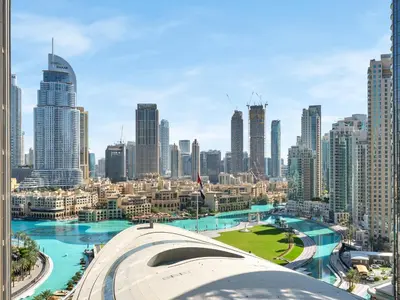 a view of a city with tall buildings at Kensington - 1BR Fountain-view Flat Downtown in Dubai