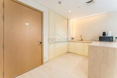 a large door in a kitchen with a counter at Community View, Near Dubai Creek Harbour Marina Walk - Summer at Creek Beach Building 2 by Deluxe Holiday Homes in Dubai