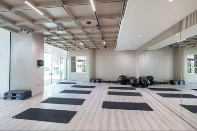 a yoga room with black mats on the floor at Vogue JVC Binghatti Phantom near Circle Mall, One Bedroom Apartment with Large Balcony and City View, Access to all Amenities in Dubai