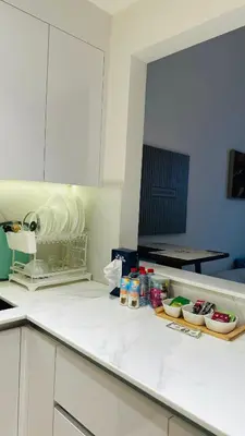 a kitchen with a counter top with food on it at Kats in Dubai