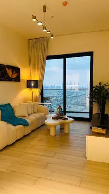 a living room with a couch and a table at Kats in Dubai