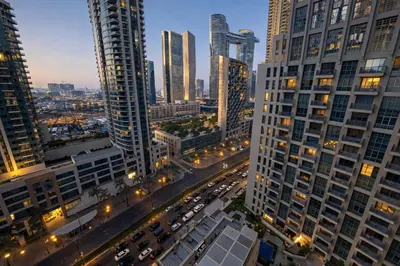 an aerial view of a city with tall buildings at 1BR with Burj Khalifa Modern Comfort in Dubai