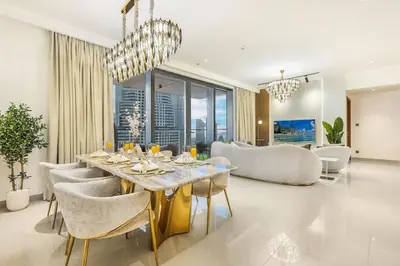 a dining room with a table and chairs at Keylid Stunning3BR and Maid connected to Dubai Mall in Dubai