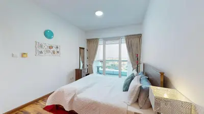 a bedroom with a bed and a large window at 2 bedroom JLT with park view in Dubai