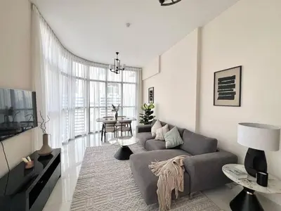 a living room with a couch and a table at 1BR Amazing Burj And Dubai View in Dubai