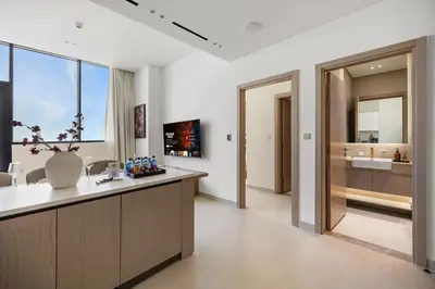 a bathroom with a counter and a sink in a room at New 1BR with Private Pool Near Circle Mall in Dubai