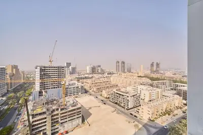 an aerial view of a city with tall buildings at Cozy 1BR Retreat in Binghatti Amber JVC in Dubai