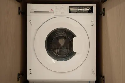 a white washing machine in a room at Royale Family Apartment 281 with Plunge Pool in Dubai