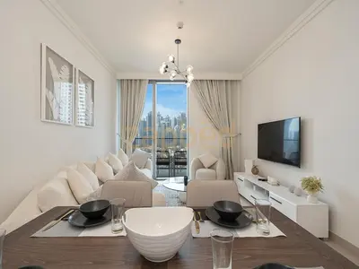 a living room with a couch and a table at Zapbed House Luxury 2BR at Boulevard Point Walk to Dubai Mall in Dubai