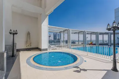 a swimming pool on the roof of a building at Maison Privee - Comfortable Downtown Apartment with City Skyline Vws in Dubai