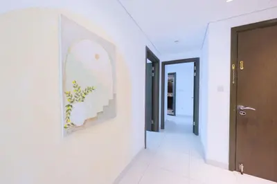 a hallway of a house with a painting on the wall at Premium Burj Khalifa View Downtown Dubai in Dubai