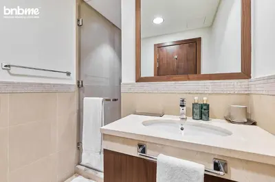 a bathroom with a sink and a mirror at bnbmehomes - Burj Vista Tower 1 in Dubai