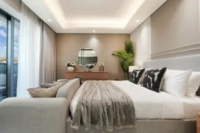 a bedroom with a large bed and a mirror at Modern 1BR Escape with Balcony View in Dubai