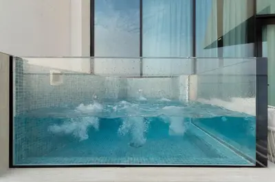 a swimming pool in the middle of a building at The Royale Blue Luxury Suite 325 Private Plunge Pool in Dubai