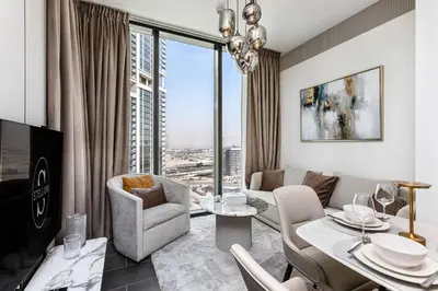 a living room with a view of a city at Elegant 1BR Sobha Crest City Views in Dubai