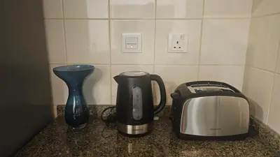 a counter with a toaster and a toaster and a blender at Bay Central 1BR with Full Marina View in Dubai