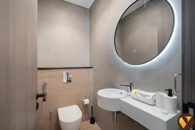 a bathroom with a sink and a mirror at Vogue Business Bay Royal Regency near Downtown, Burj Khalifa and Dubai Mall, One Bedroom Apartment with Balcony and partial Burj Khalifa view, Access to all Amenities in Dubai