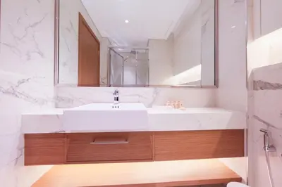 a bathroom with a white sink and a mirror at Modern Studio Azizi Riviera 59 Al Merkadh Community in Dubai