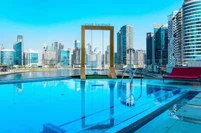 a swimming pool with a view of a city skyline at Downtown View 2BHK in Dubai