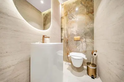 a bathroom with a sink and a toilet at Spacious 1BR in JVC with Pool and Gym Access in Dubai