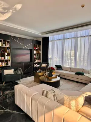 a large living room with a couch and a table at Iconic Triplex Penthouse in Marina in Dubai