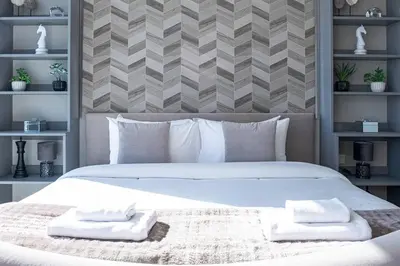 a bedroom with a large bed with towels on it at The Address JBR, Address Beach Resort, Marina View - Onelink in Dubai