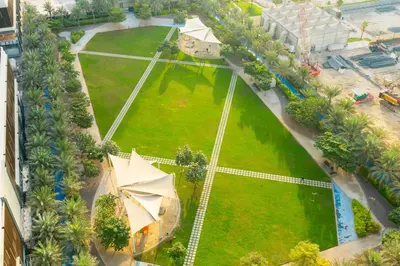 an aerial view of a park with a playground at CitiHome - Spacious 2BR - Park Gate Residences in Dubai