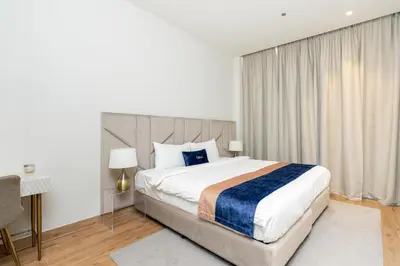 a bedroom with a large bed and a window at CitiHome - Iconic 1BR Jumeirah Living Marina Gate in Dubai