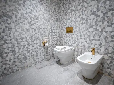 a bathroom with a toilet and a sink at Daniels Spacious 3BR with Maid at Five Palm Jumeirah in Dubai