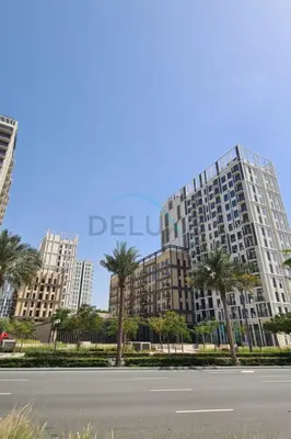 an empty street in front of a large building at Steps from Dubai Hills Mall, Near Scenic Park, and Easily Connected to Dubai Top Attractions - Socio Tower 1, Dubai Hills by Deluxe Holiday Homes in Dubai
