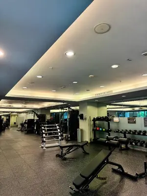 a gym with lots of equipment in a room at Urban Core - Downtown Dubai in Dubai