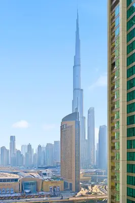 a view of a city skyline with a tall skyscraper at 3bd apartment in downtown dubai in Dubai