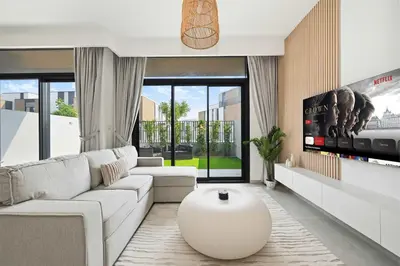 a living room with a white couch and a large coffee table at Incredible Family Townhouse Villa I Sleeps 10 in Dubai