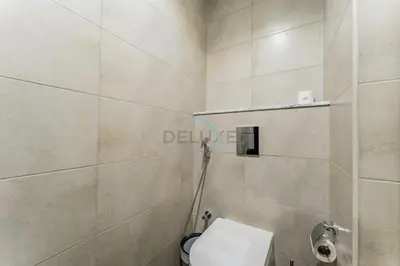 a bathroom with a toilet in a room at Minutes from Downtown Dubai and Burj Khalifa, Easy Metro Access, Seamless Connectivity to Marina and Palm Jumeirah - Aykon City 2 Tower C, Business Bay by Deluxe Holiday Homes in Dubai