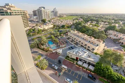 an aerial view of a city with buildings at Family-Friendly Apartment, Few Minutes Drive to Dubai Marina, Miracle Garden and Mall of the Emirates - Elite Residences 4, Sports City by Deluxe Holiday Homes in Dubai