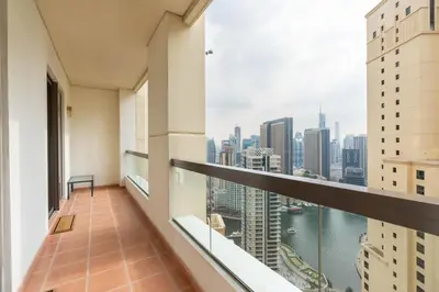 an apartment balcony with a view of the city at White Sage JBR Sadaf Large 1BR on High Floor with two balconies in Dubai