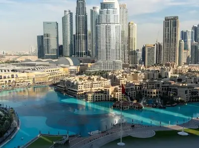 a view of a city with tall buildings and a river at Breathtaking 2Bedroom front-row Burj Khalifa & Fountain Views from Balcony, Grande Signature Residences in Dubai