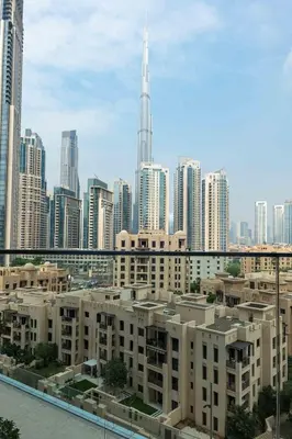 a view of a city with tall buildings at Iconic Burj Khalifa View - Elegant 1BR Apartment in Dubai