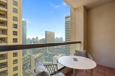 a balcony with a table and a view of a city at Designer 2Bedroom in Rimal near to JBR Beach in Dubai