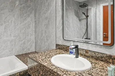 a bathroom with a sink and a mirror at Luxury 2BR l High Floor l Marina View l JBR in Dubai