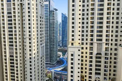 an aerial view of a city with tall buildings at Luxury 2BR l High Floor l Marina View l JBR in Dubai