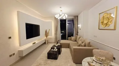 a living room with a couch and a tv at Skyline Vida Dubai Mall 3 Bedroom Apartment I Burj Khalifa Views I Direct Access Dubai Mall I Parking, Gym, Wi-Fi & Pool in Dubai