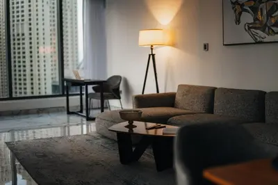 a living room with a couch and a table at Luxury 2BR Huge New Apartment in Dubai