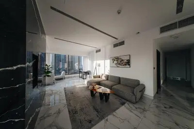 a living room with a couch and a table at Luxury 2BR Huge New Apartment in Dubai