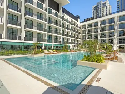 a swimming pool in the middle of a building at Modern Studio in Prime JVC Padel, Pool & Gym in Dubai
