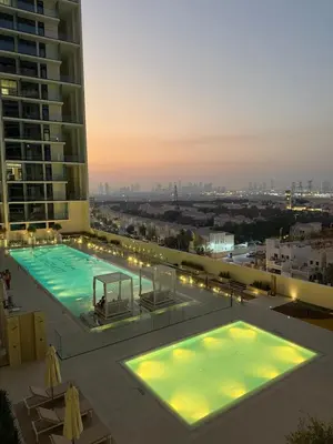 a large swimming pool on top of a building at Luxury 1BR Binghatti JVC in Dubai