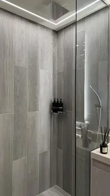 a bathroom with a shower with a glass door at Stunning Brand New Stylish Studio in JVC in Dubai