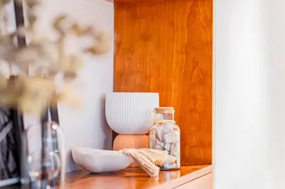 a table with a glass jar and a bowl on it at DIFC 1 Bed, City View, 600m to Metro, Sleeps 4 in Dubai