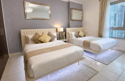 a hotel room with two beds and a window at Elite Royal Apartment - Sky Series - Highest Apartment Floor - Full Burj Khalifa & New Fountain View - Eternal in Dubai